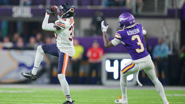 Nov 27, 2023; Minneapolis, Minnesota, USA; Chicago Bears cornerback Jaylon Johnson (33) intercepts a pass intended for Minnesota Vikings wide receiver Jordan Addison (3) in the second quarter at U.S. Bank Stadium. Mandatory Credit: Brad Rempel-USA TODAY Sports